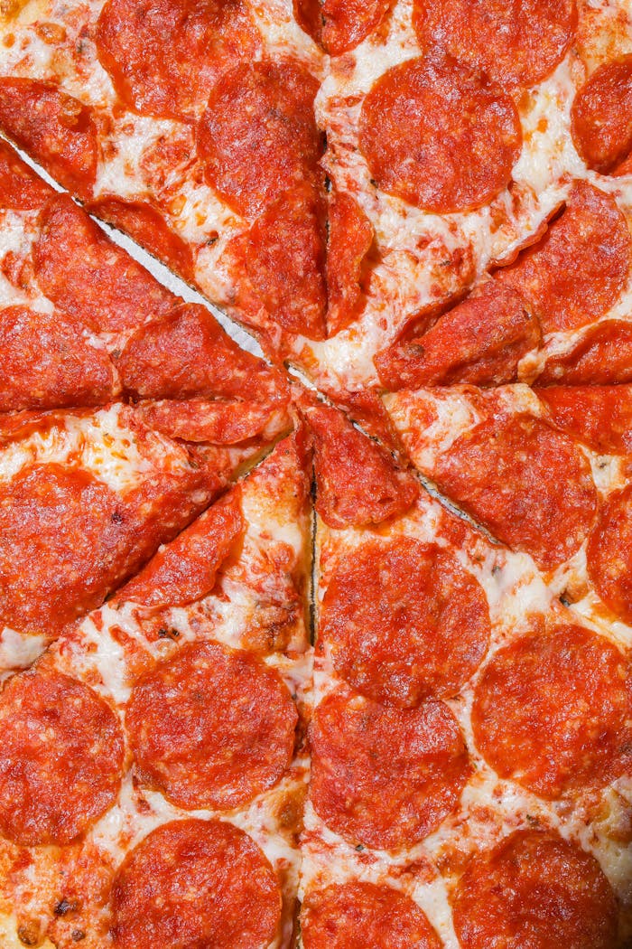 Close-up of a cheesy pepperoni pizza with mouth-watering toppings.